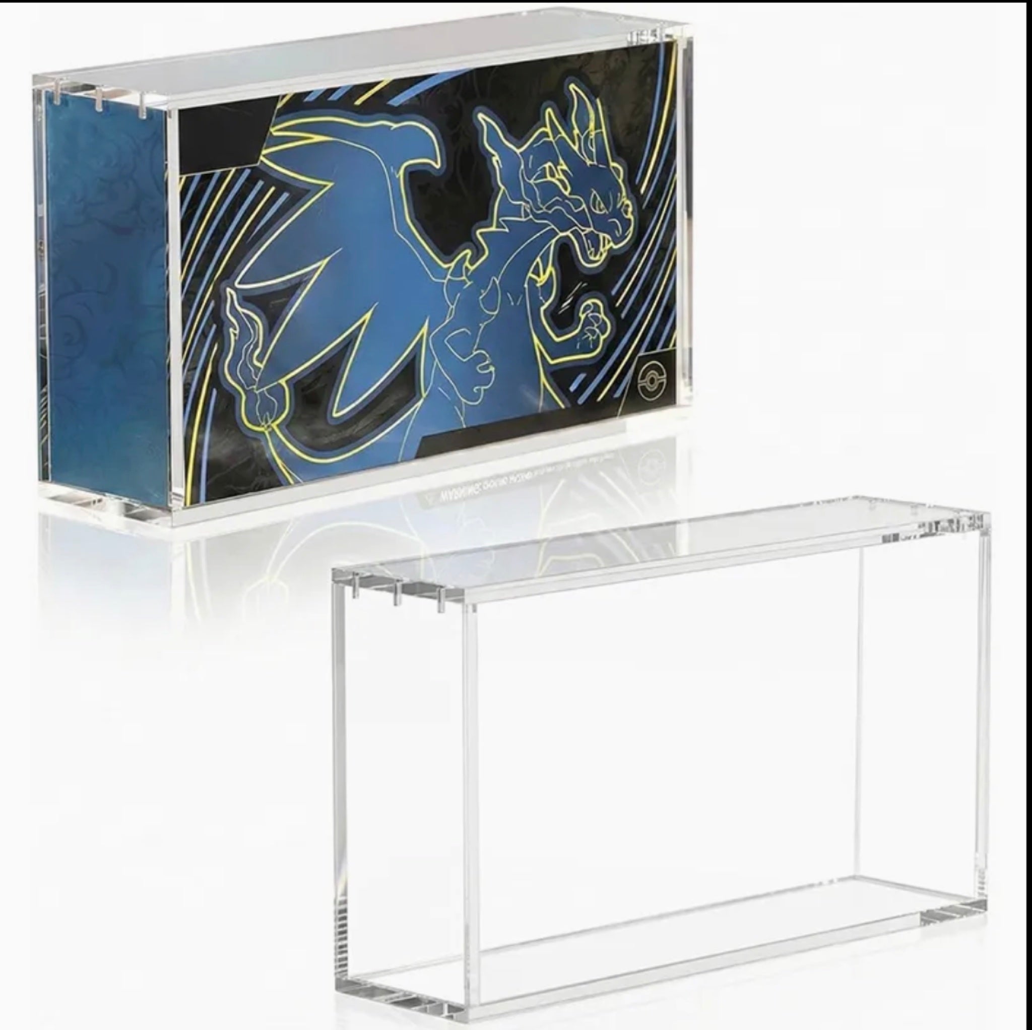 Clear acrylic hard protector case for Pokémon TCG Ultra Premium Collection (UPC) boxes, shown with a Mega Charizard X UPC inside and an empty case beside it